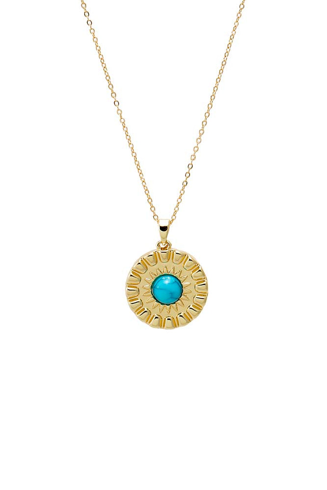 Gold necklace with a turquoise pendant on a white background