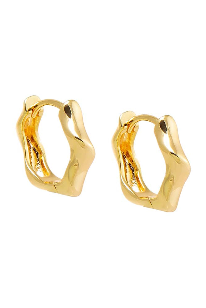Gold hoop earrings on a white background