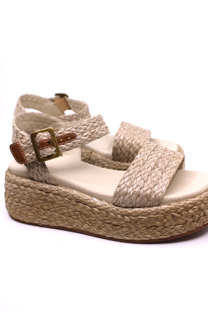 raffia and a woven ankle strap platform sandals, with leather lining and a padded footbed for ultimate comfort. features  a 2" heel and 1 1/2" platform in ivory color from chocolat blu
