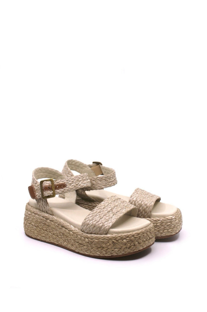 raffia and a woven ankle strap platform sandals, with leather lining and a padded footbed for ultimate comfort. features  a 2" heel and 1 1/2" platform in ivory color from chocolat blu