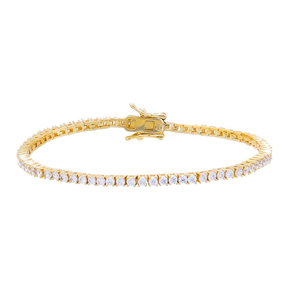 Gold bracelet with clear stones on a white background