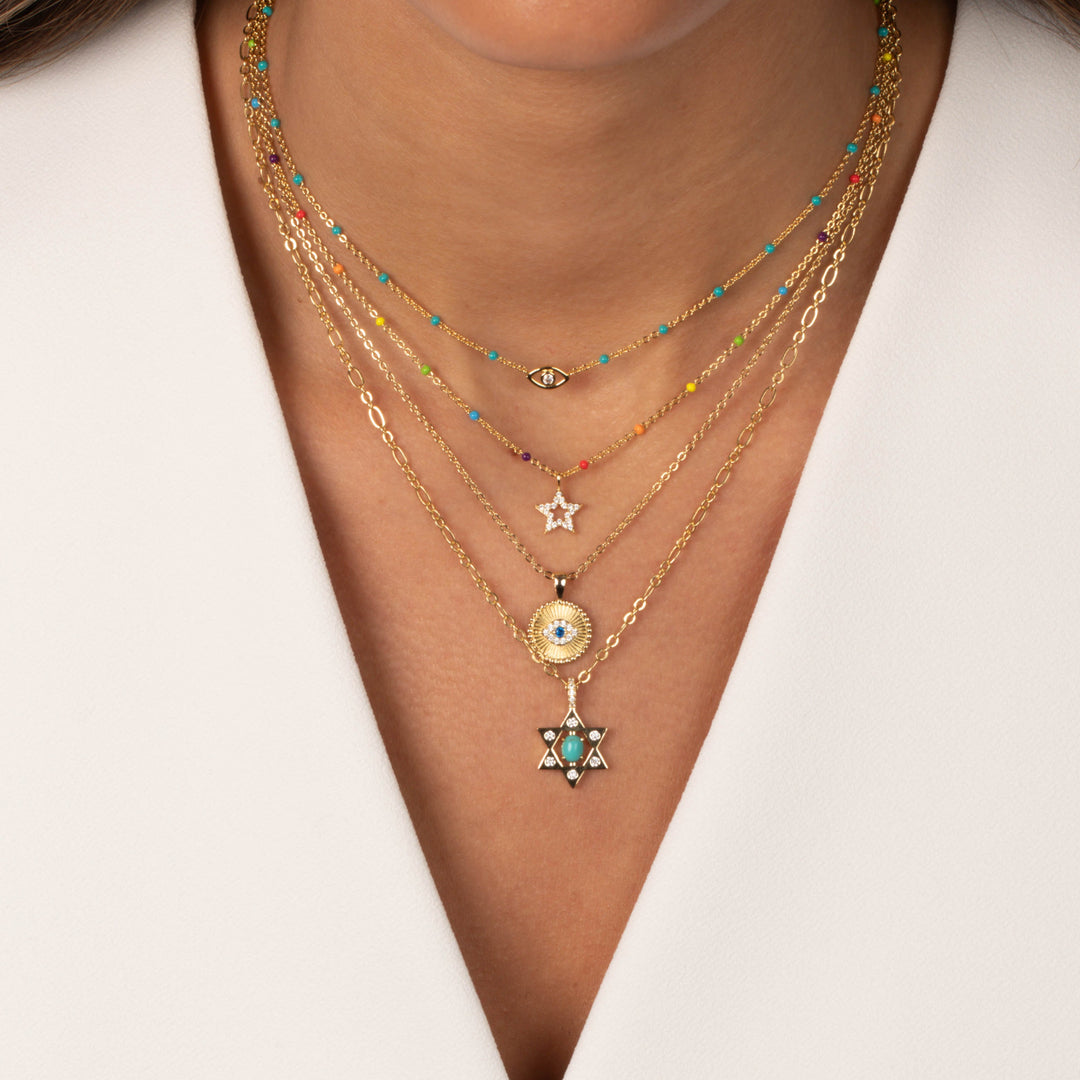 Necklace with star-shaped pendant on a white background