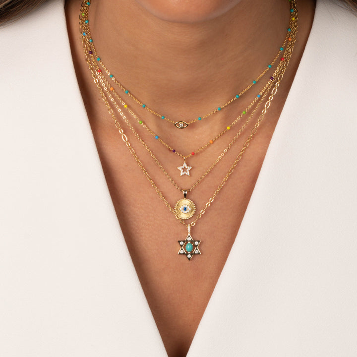 Necklace with star-shaped pendant on a white background