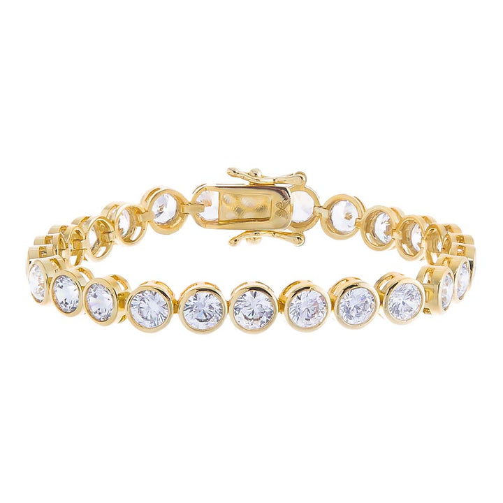 Gold bracelet with clear gemstones on a white background