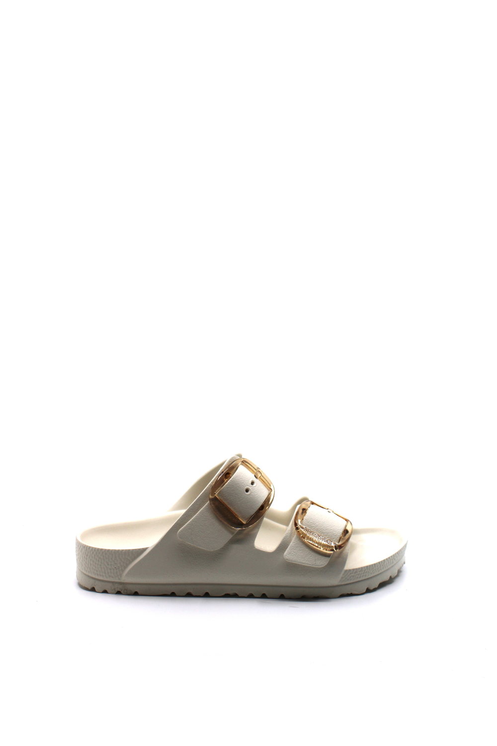 white waterproof sandals with 2 straps and large gold buckle closures.