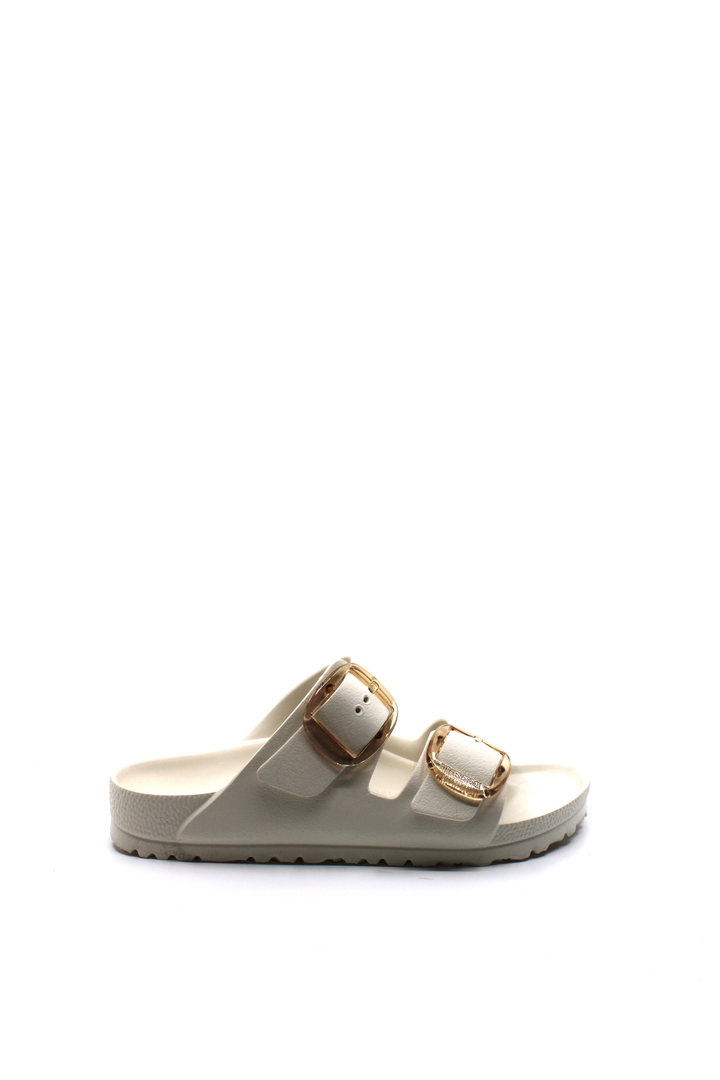white waterproof sandals with 2 straps and large gold buckle closures.