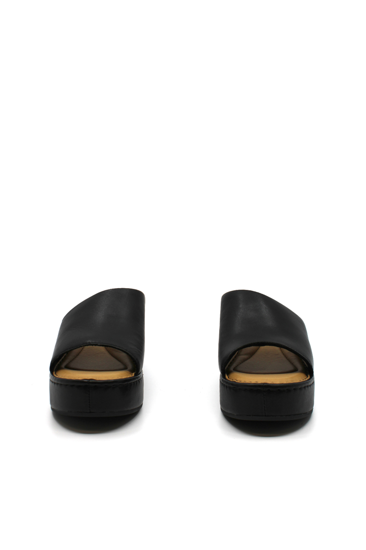 Pair of black open-toe platform shoes on a white background