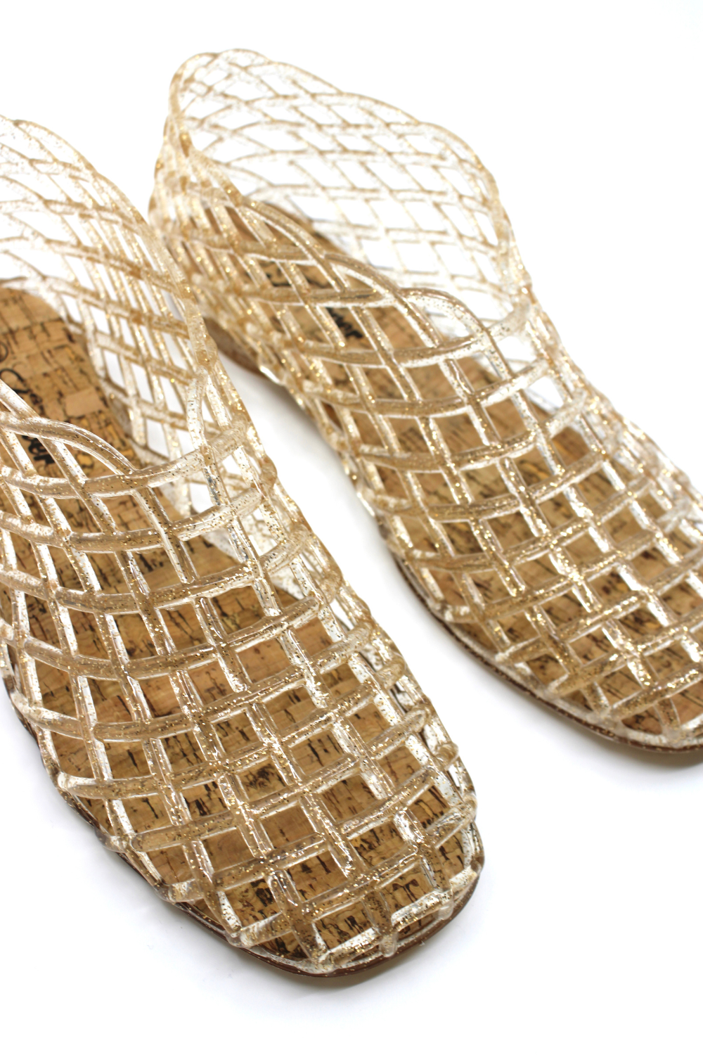 Pair of woven sandals on a white background