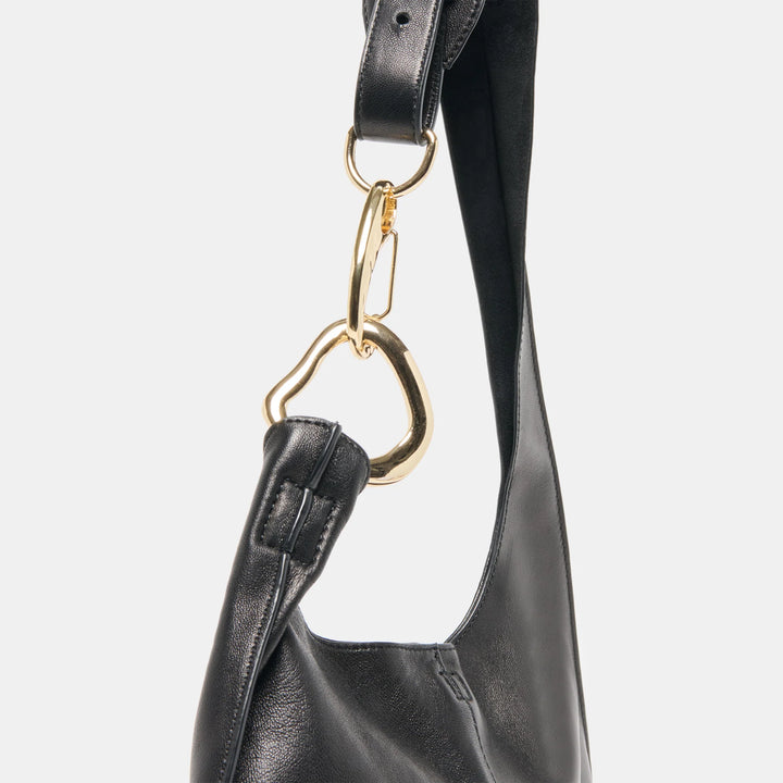 Black leather handbag with a gold clasp 