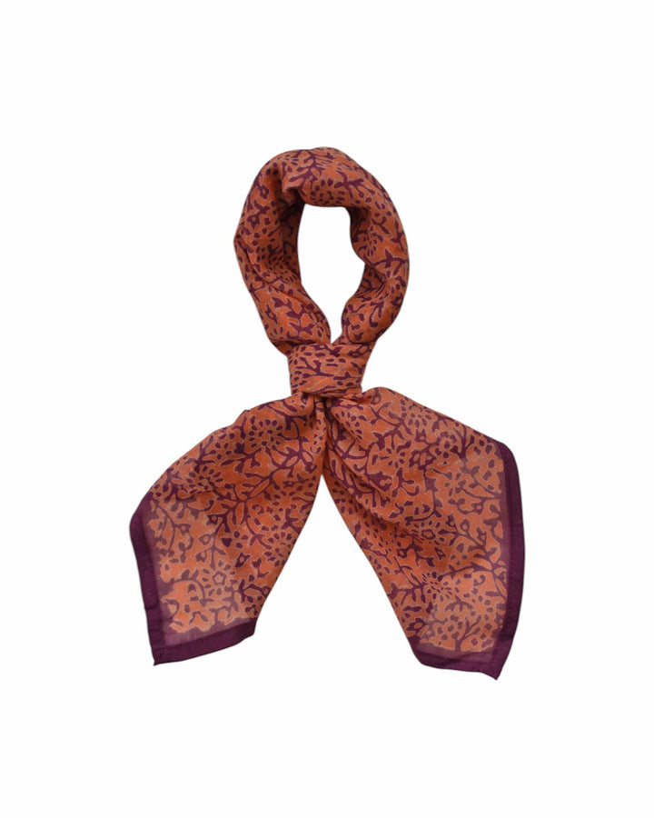 Brown patterned scarf on a white background