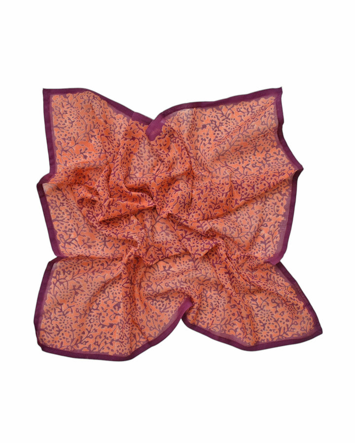 Folding patterned fabric on a white background