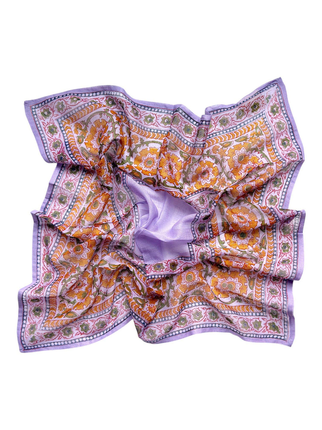 Patterned fabric with orange and green design on a white background