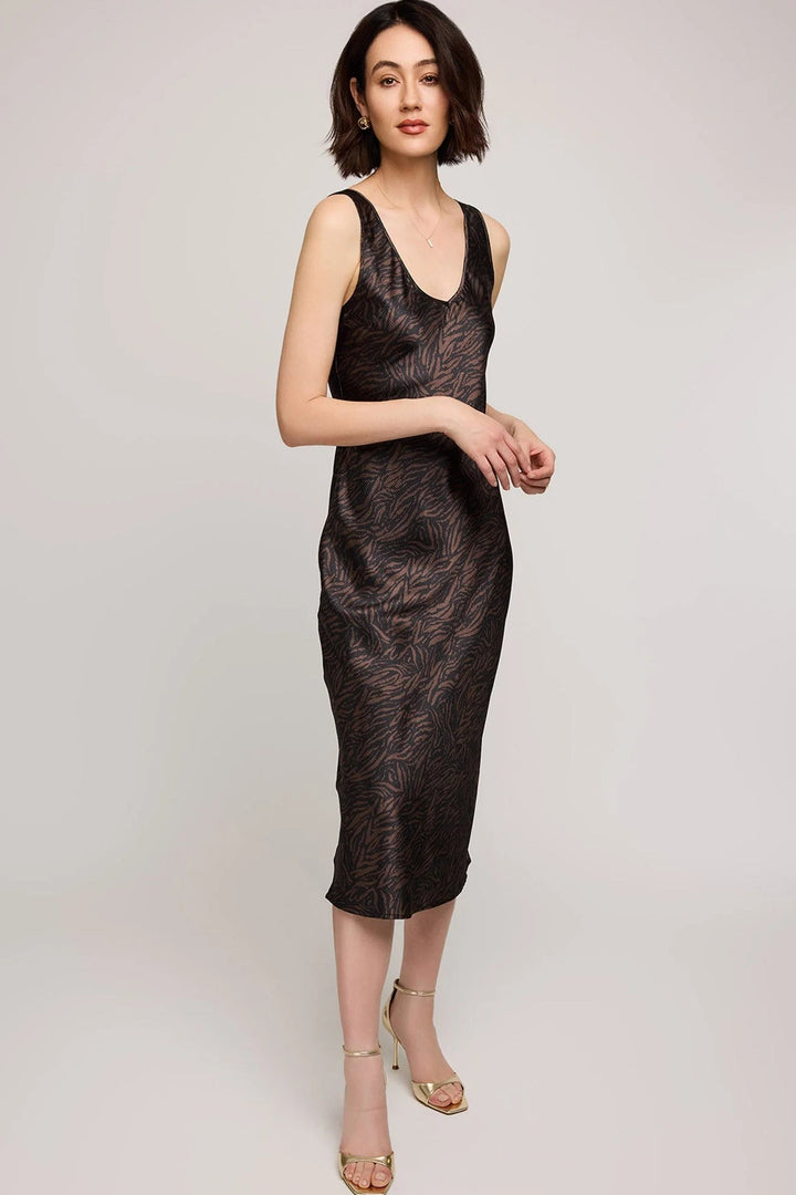 Woman wearing a black textured dress on a light gray background