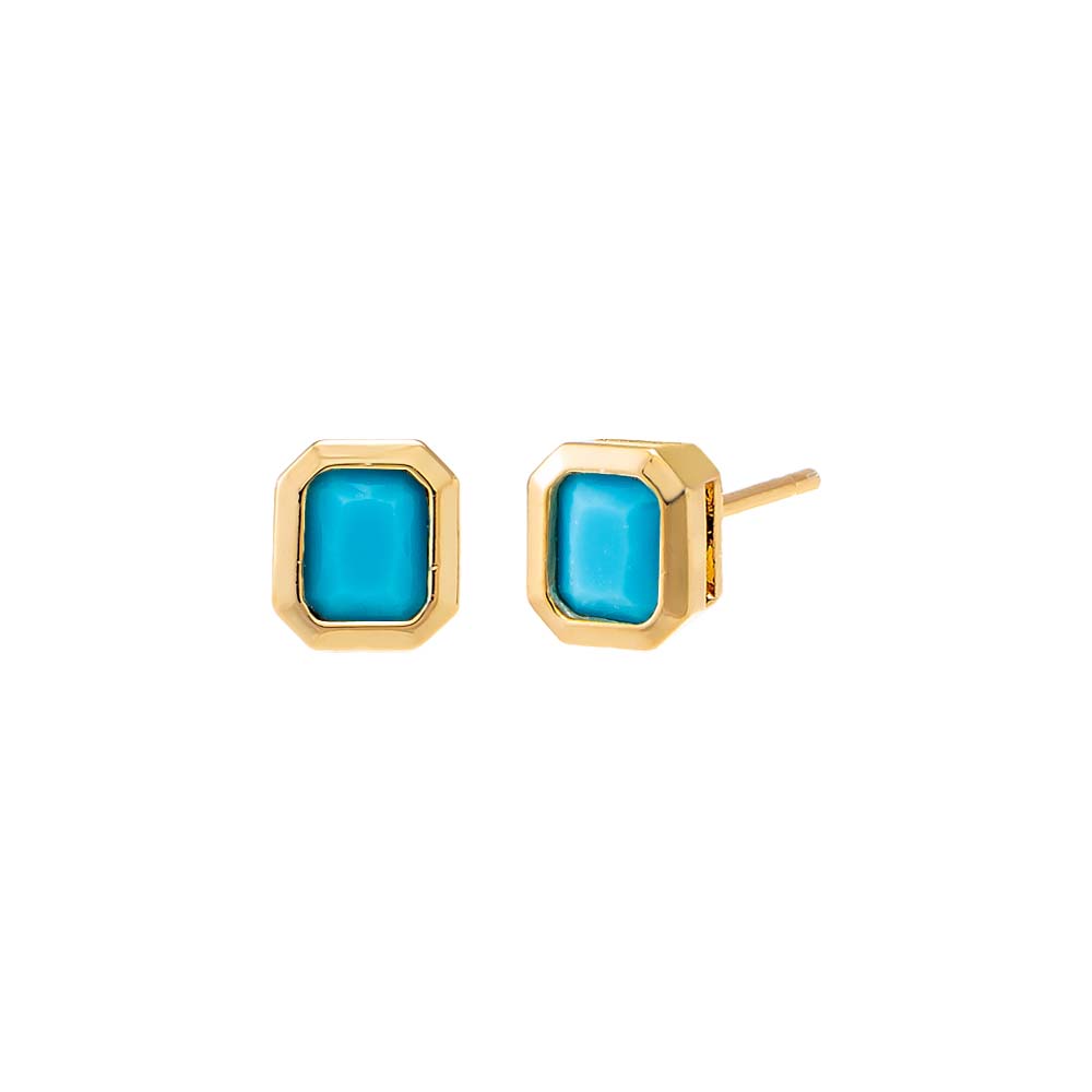 Gold earrings with turquoise stones on a white background