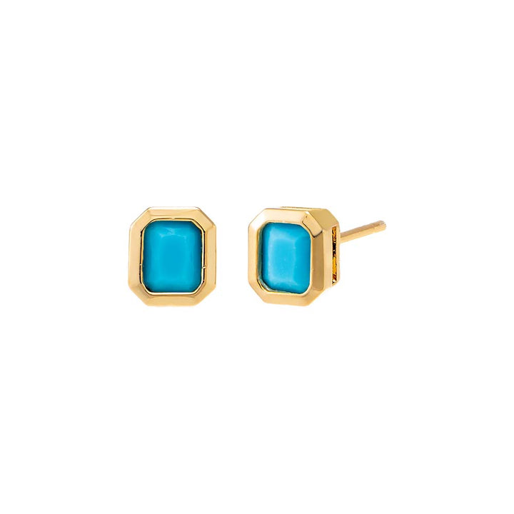Gold earrings with turquoise stones on a white background