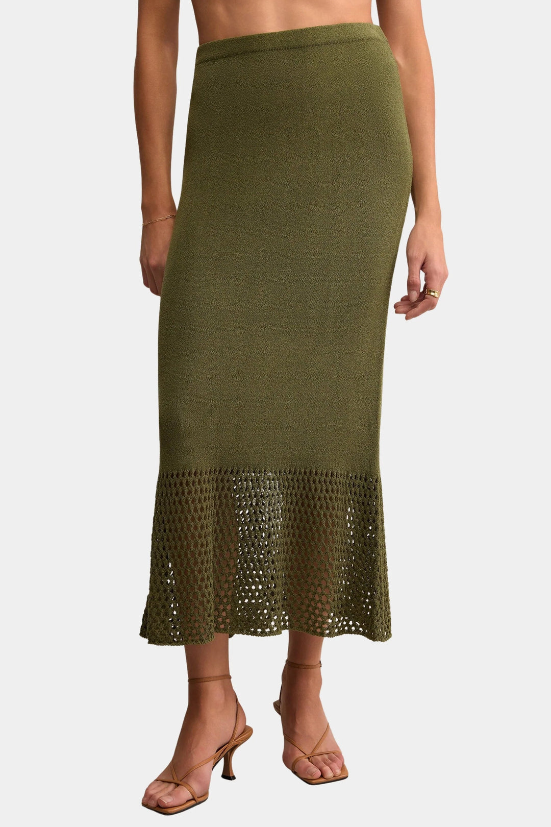 Green skirt with lace hem on a white background