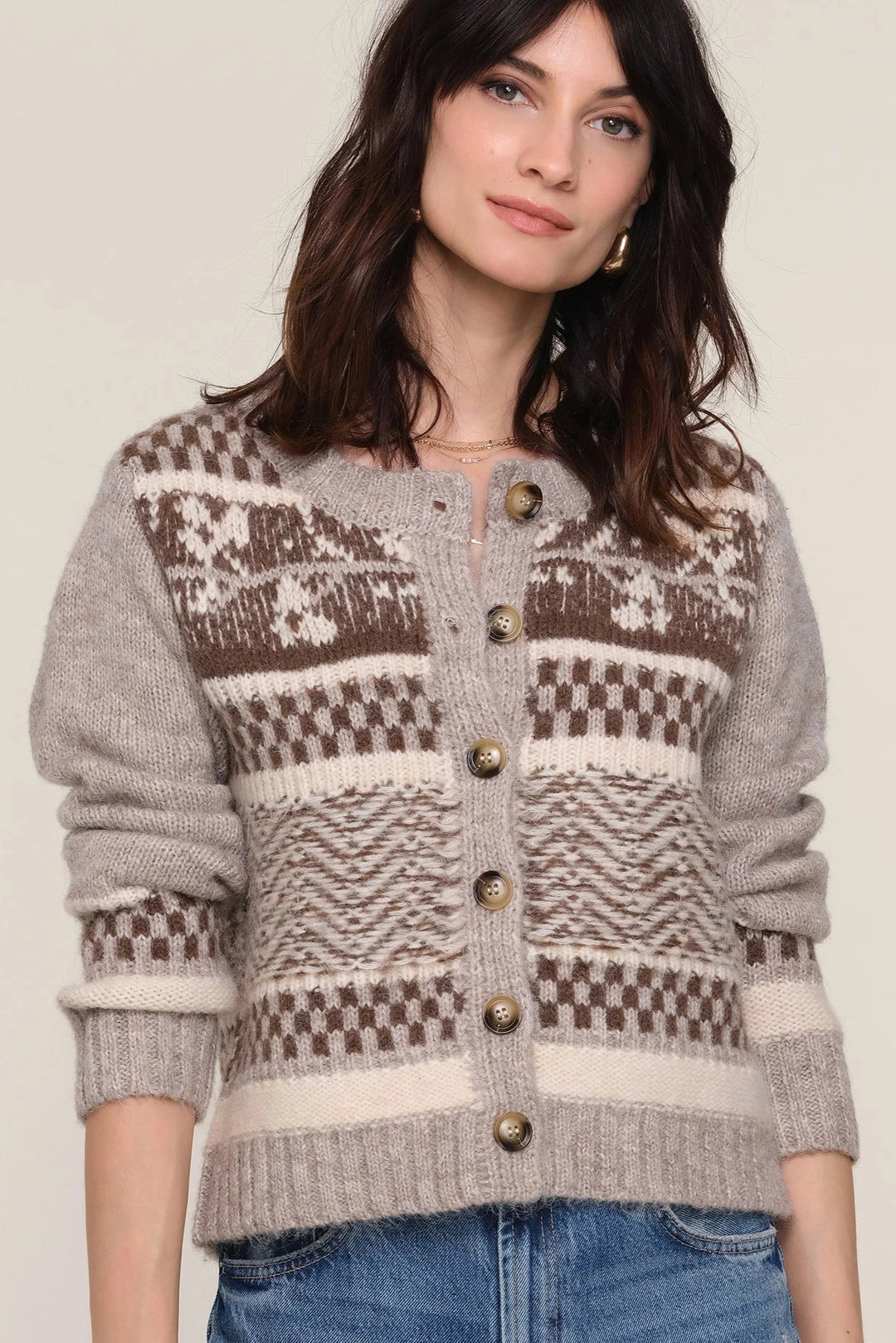 Long sleeve button up cardigan with brown and cream colored design 