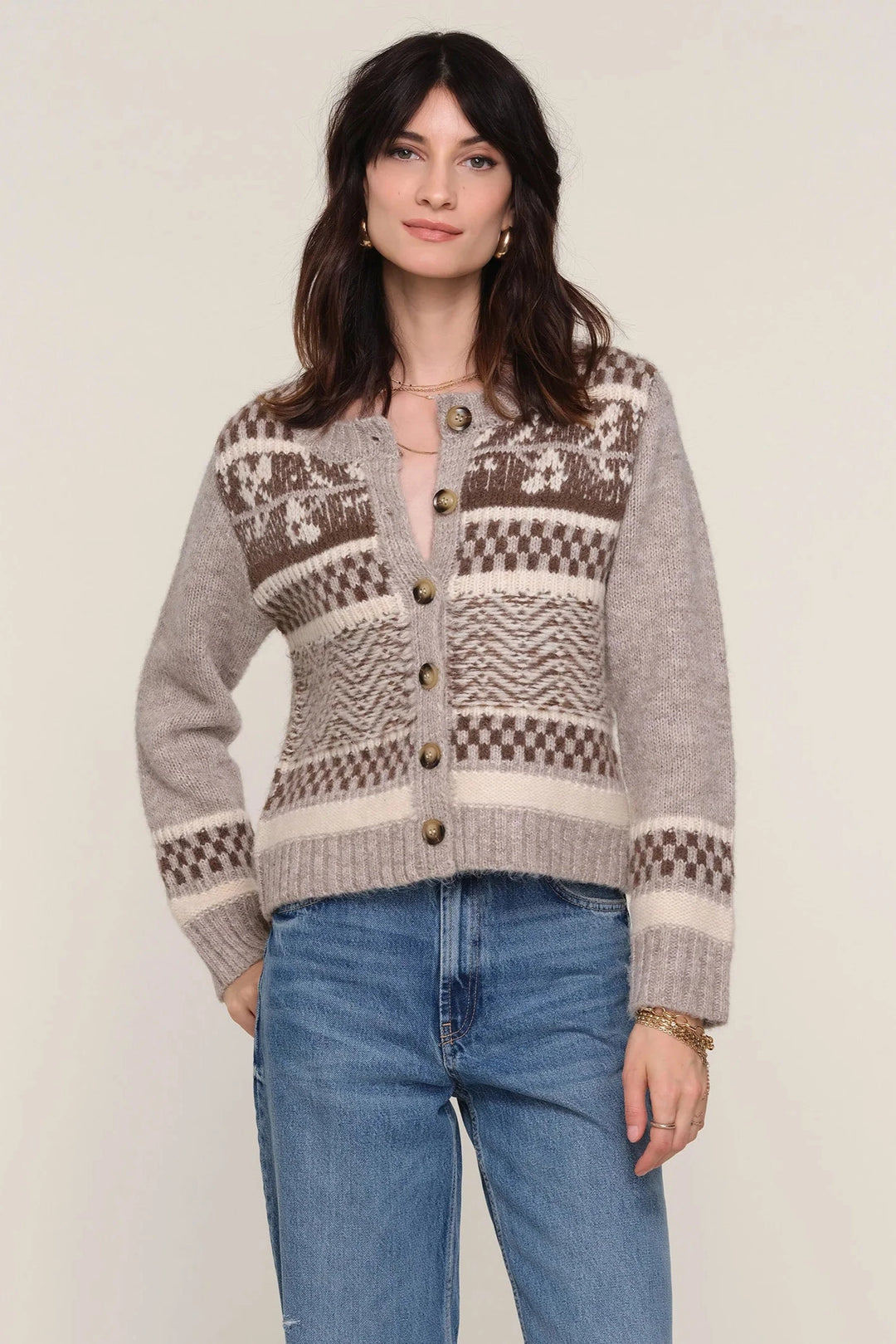 Long sleeve button up cardigan with brown and cream colored design 