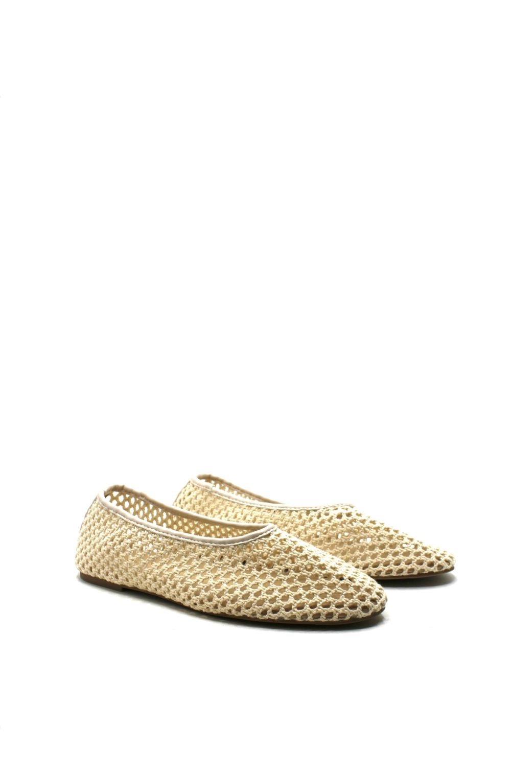 Pair of beige woven shoes on a white background