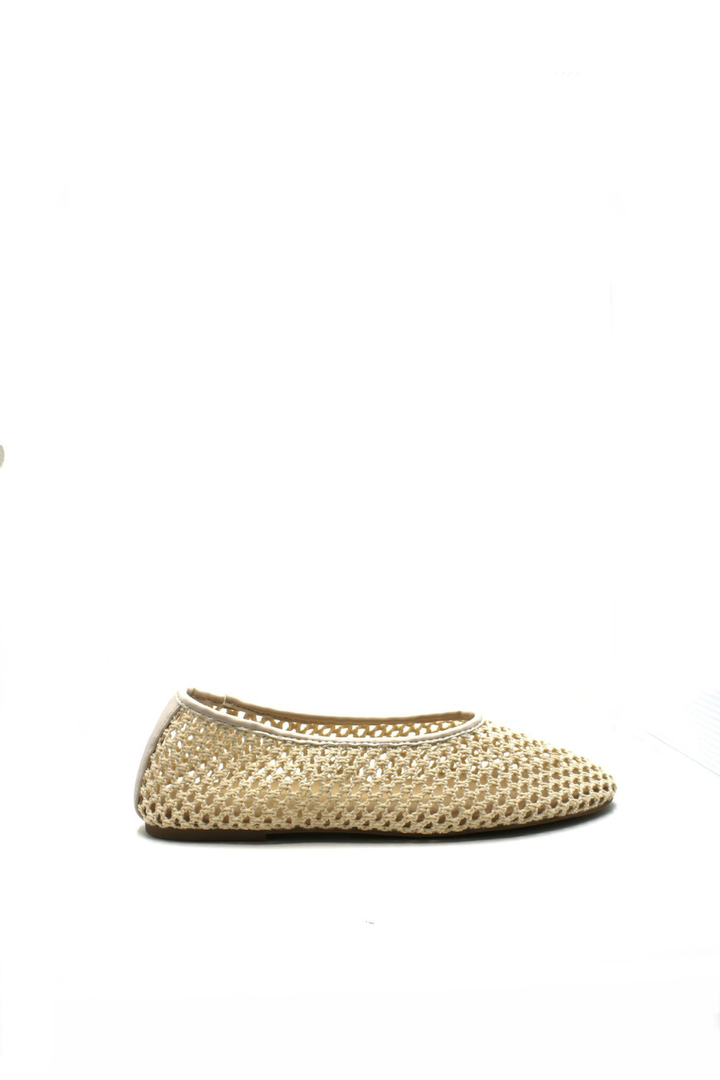Gold ballet flat shoe on a white background
