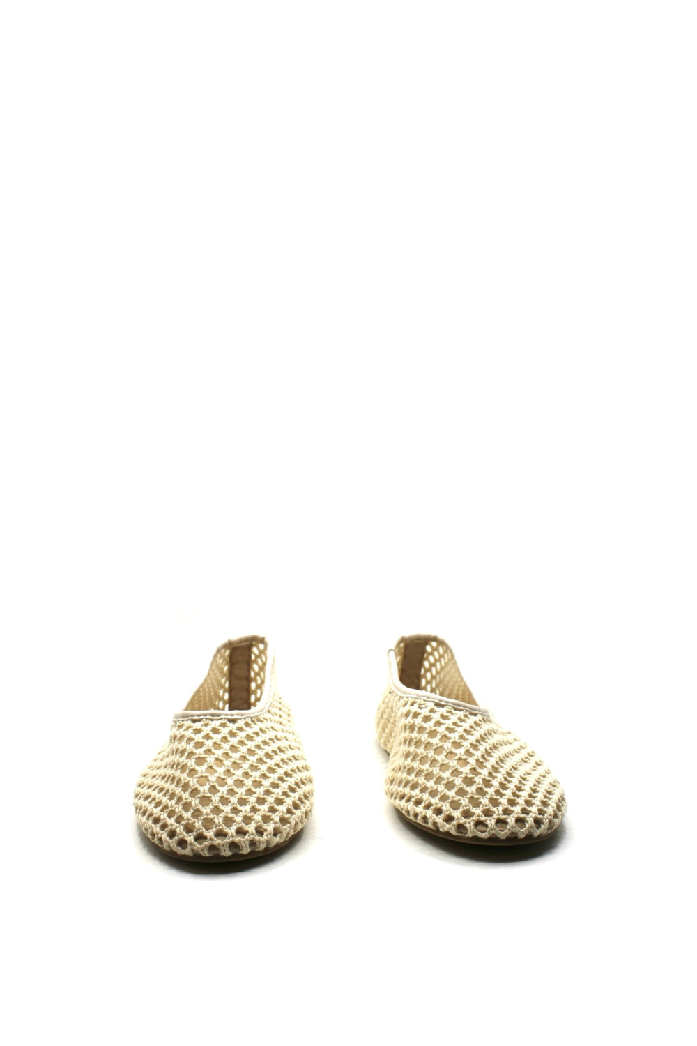 Pair of beige woven shoes on a white background