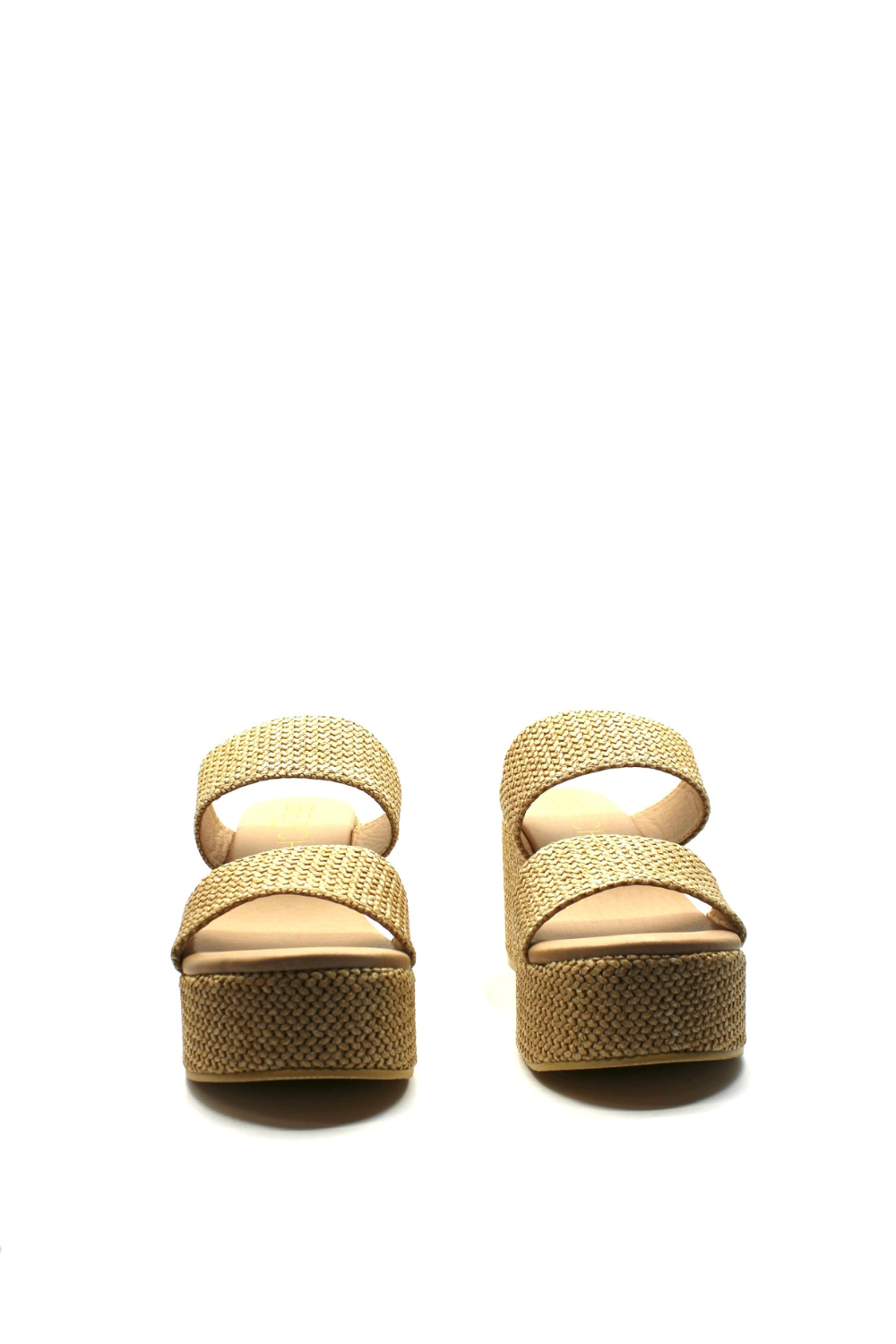 Pair of beige sandals on a white background