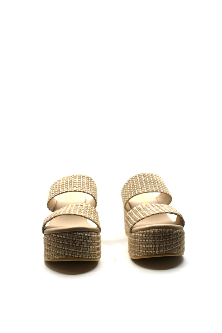 Pair of gold sandals with rhinestone embellishments on a white background