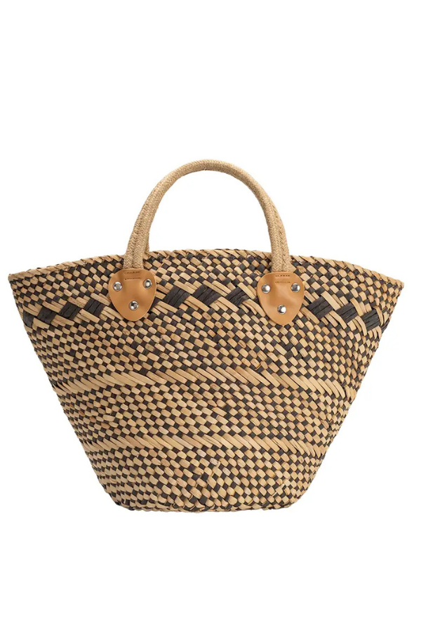Woven handbag with leather handles on a white background