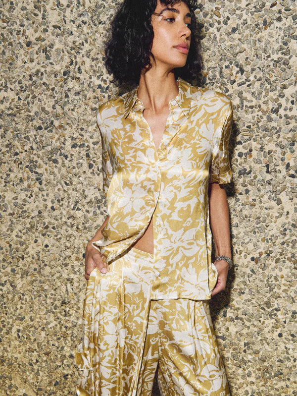 Nation LTD Odin Button Up Shirt in Gold Botanical Floral front view - dear lucy Hammered Satin fabric, button front, collared, blouse with a gold and white botanical flower pattern.