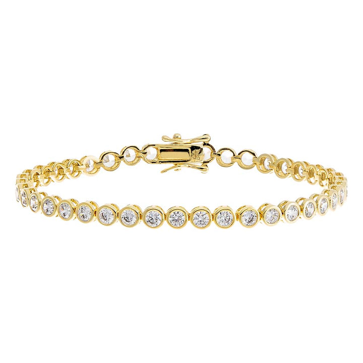 Gold bracelet with clear stones on a white background