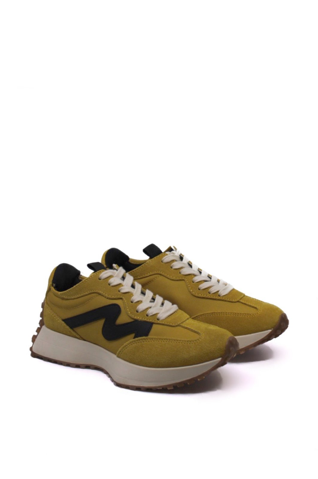 Steve Madden Campo Mustard side view- Dear Lucy Add some "sole" to your step with the Steve Madden Campo Mustard sneakers. The platform sole, complete with unique treads extending from heel to toe, pairs perfectly with the dynamic panel design for an extra touch of texture. These kicks will have you standing out in the best way possible.