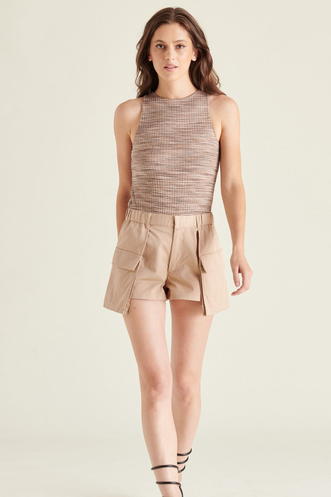 Steve Madden Nico Bodysuit in Multi - Whim BTQ This sleek and stylish bodysuit features a trendy multi-colored design that will make you stand out from the crowd