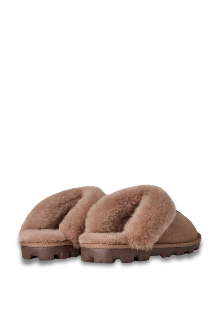 Pair of brown UGG slippers with sherpa lining