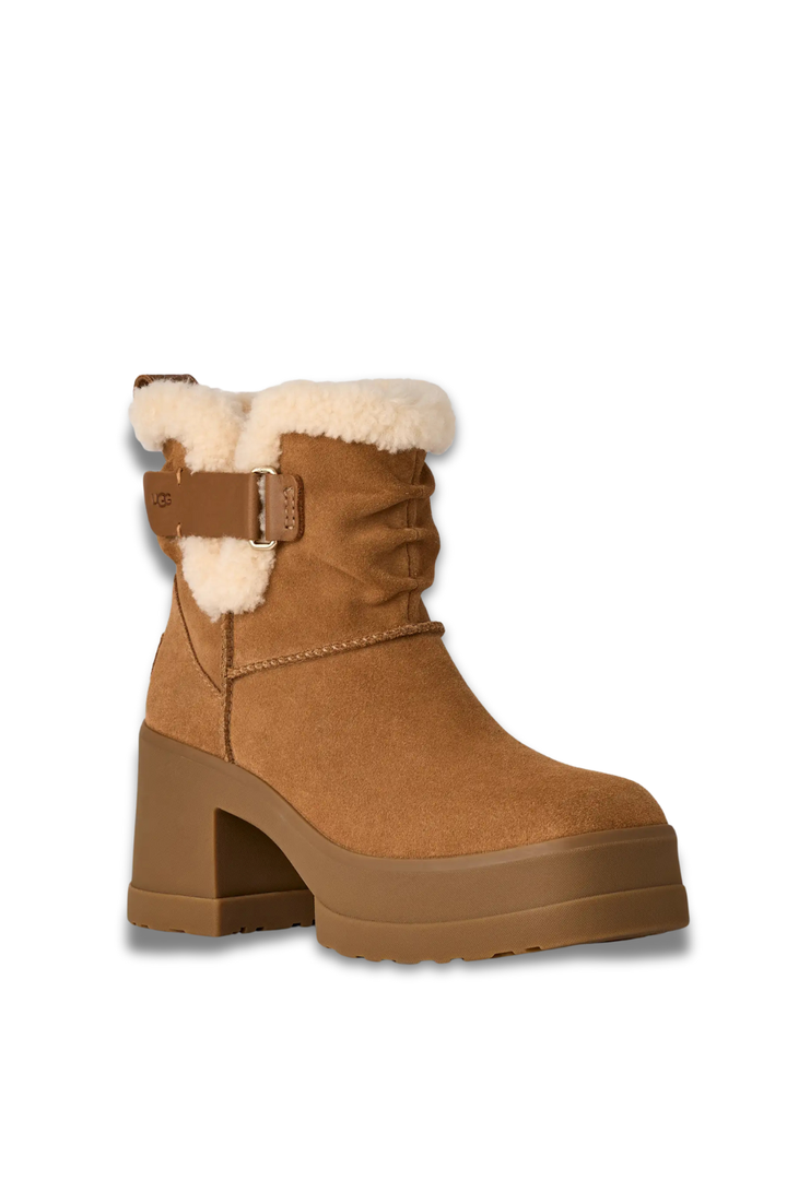 Brown winter boot with white fur trim on a white background