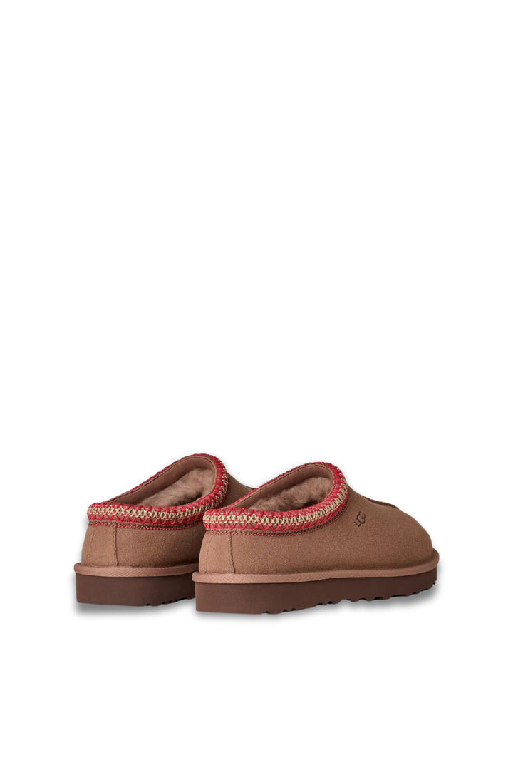 Brown UGG slipper with red trim and sherpa lining 