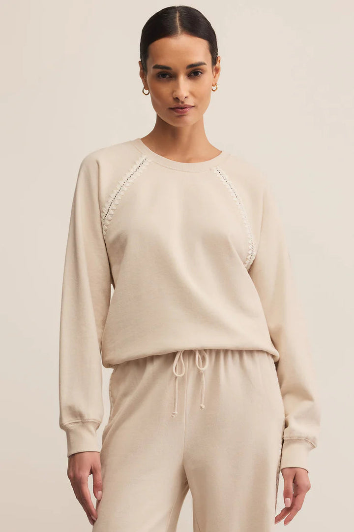 Long sleeve crew neck sweatshirt with embroidered detail in cream