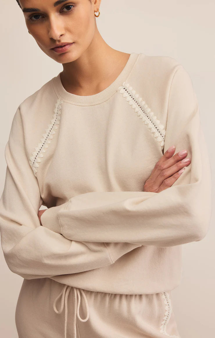 Long sleeve crew neck sweatshirt with embroidered detail in cream