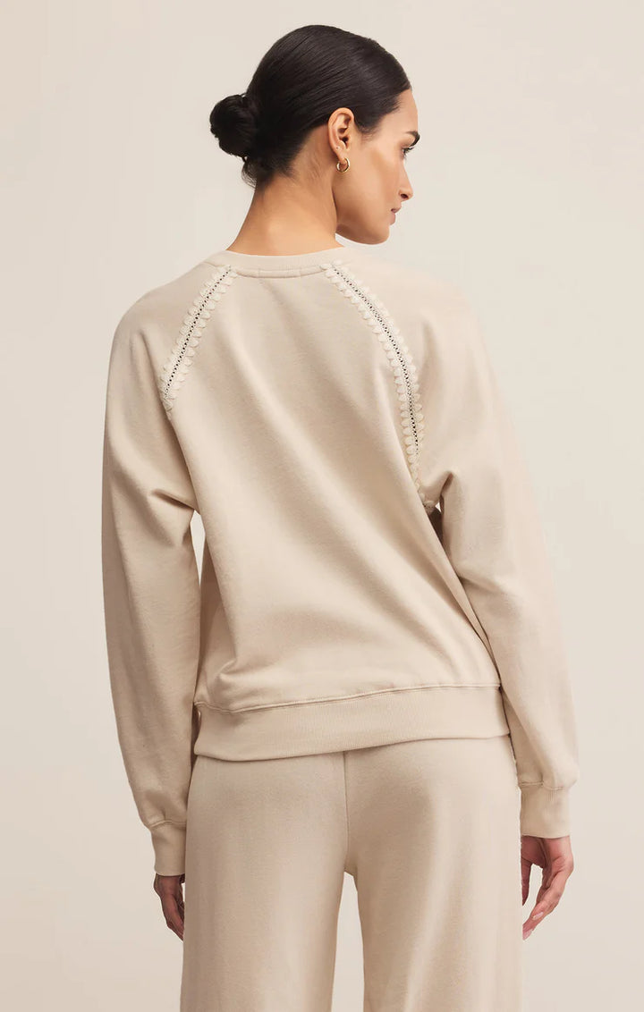 Long sleeve crew neck sweatshirt with embroidered detail in cream