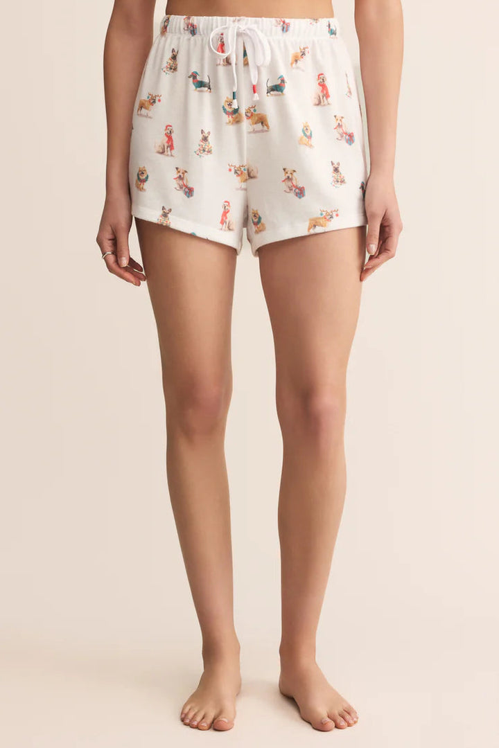 Person wearing a pair of white Z Supply pajama shorts with dog pattern