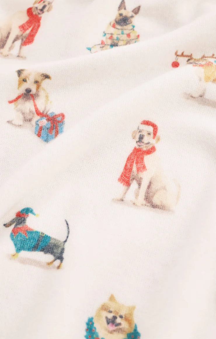 Pattern of dogs in winter clothing on white Z Supply pajamas