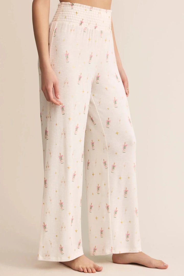 Person wearing light-colored pants with a subtle pattern on a plain background