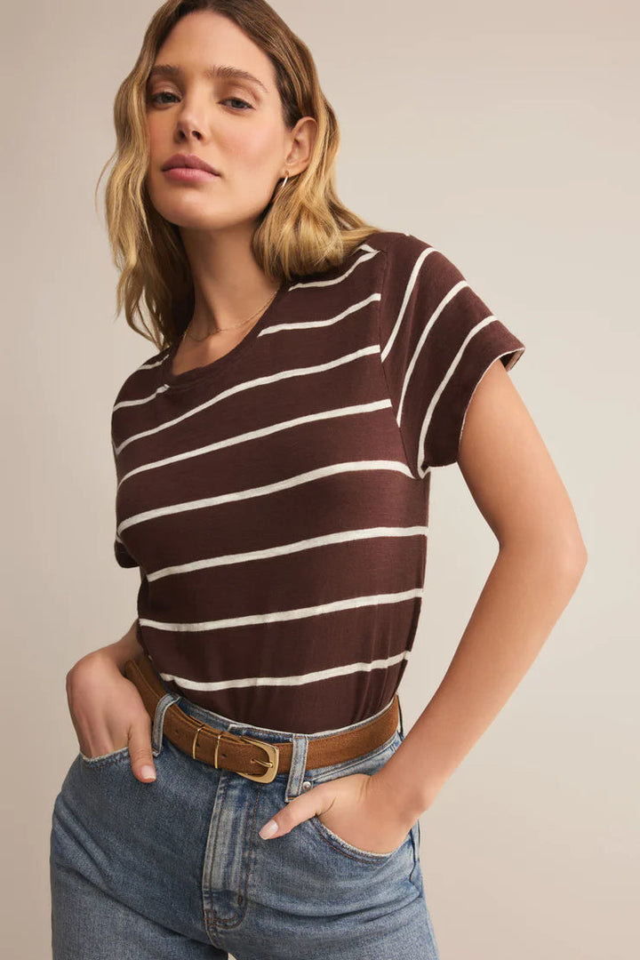 Woman wearing a brown and white striped shirt with crew neck