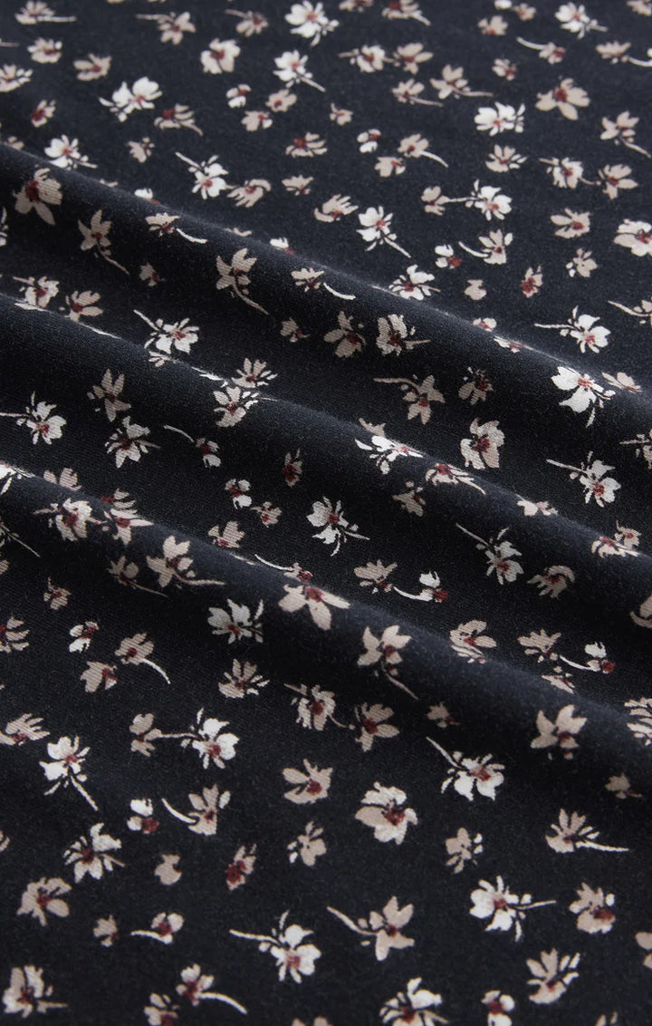  A maxi dress featuring a feminine ditsy floral print, with a  fitted silhouette, a sweetheart neckline, adjustable spaghetti straps, and smocking for a perfectly contoured fit