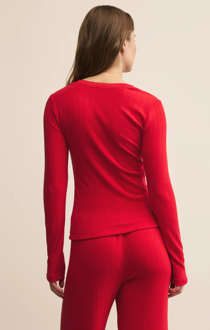 Person wearing a Z Supply red long-sleeve top back