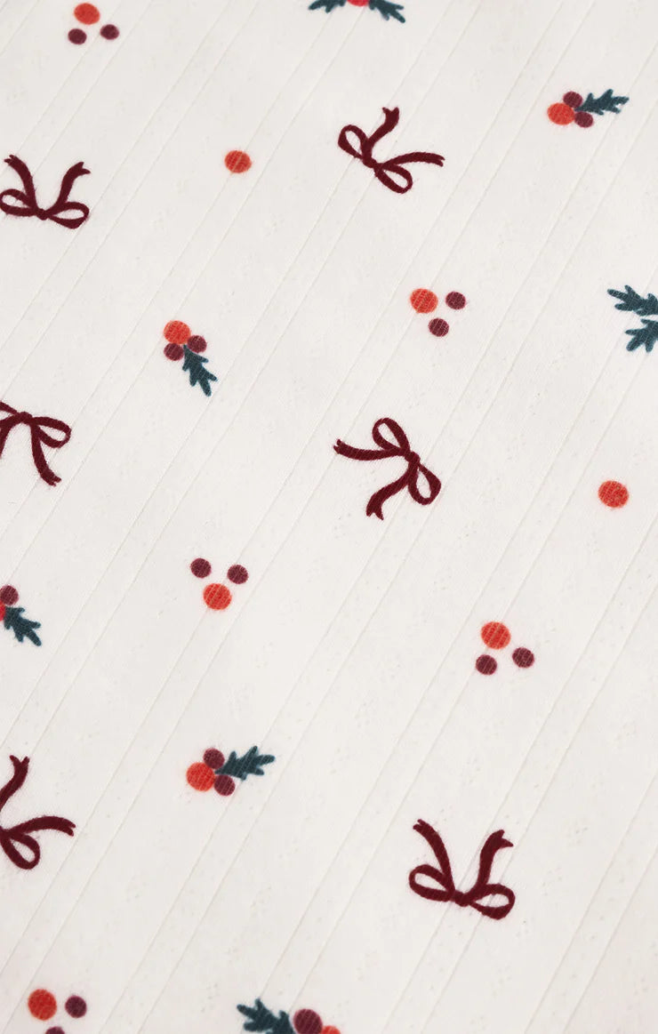 Pattern of red bows and berries on a white top Z Supply