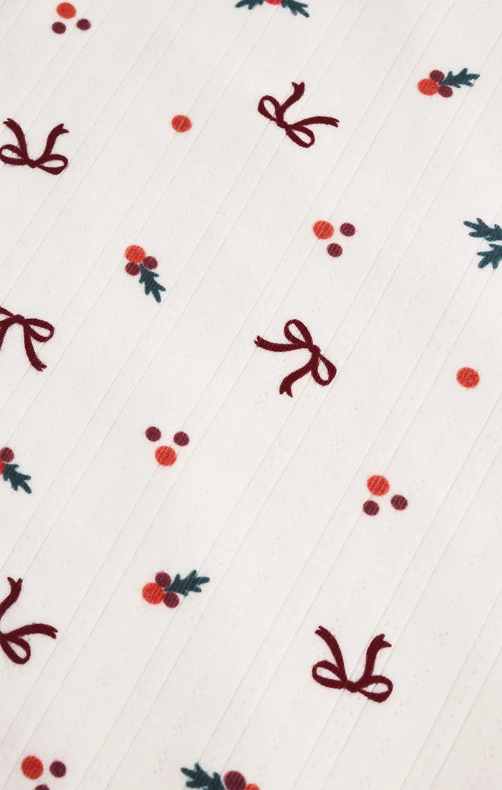 Pattern of red bows and berries on a white top Z Supply