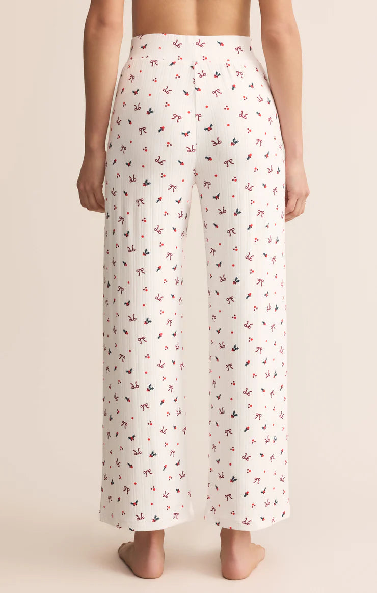 White pants with a subtle pattern worn by a person on a beige background Z Supply