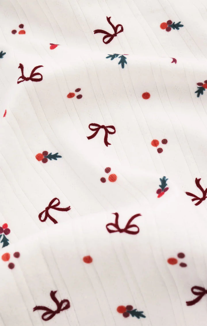 White pajama fabric with red bows and berries pattern Z Supply