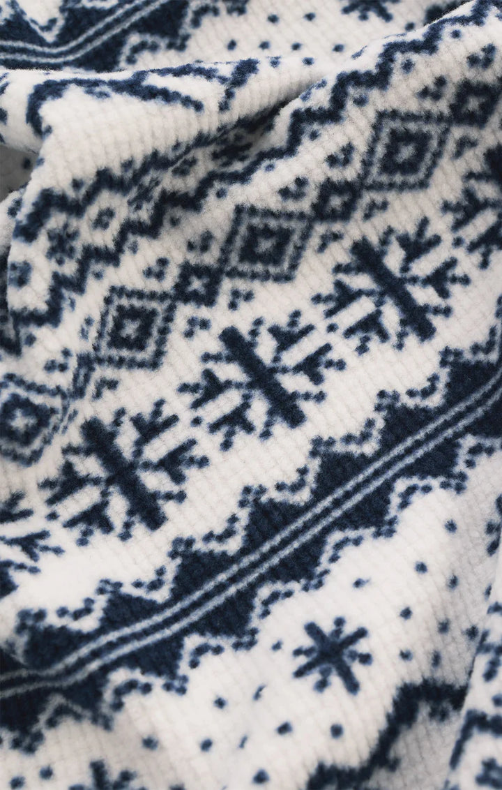 Close-up of a blue and white winter patterned fabric Z Supply 