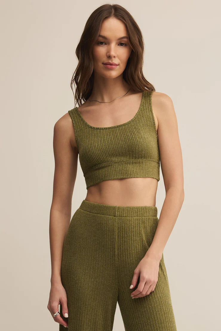 The Zoe Mini Rib Tank Bra in Fern is your new go-to for cozy, everyday support. Made from Z Supply’s ultra-soft mini rib knit, this bralette features a scoop neckline, wide straps, and a lightly supportive fit that’s perfect for lounging, layering, or sleep.